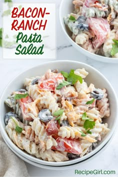 two bowls filled with pasta salad on top of a table