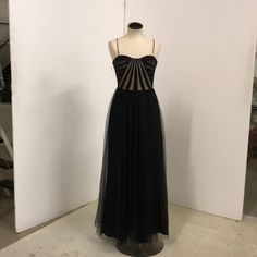 Stunning Black And Peekaboo Full Length Party Dress. Size 6. Perfect Condition - Never Worn! Black Tulle A-line Evening Dress, Black Sleeveless Evening Dress With Boned Bodice, Black Tulle Dresses For Party Season, Black Evening Dress With Boned Bodice, Black Tulle Dress For Party, Black Tulle Dress For Evening, Black Sheer A-line Dress, Black Tulle Floor-length Dress, A-line Dress With Boned Bodice For Night Out