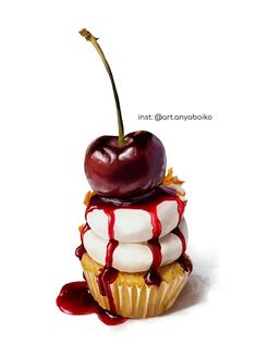 a cherry sitting on top of a cupcake covered in icing