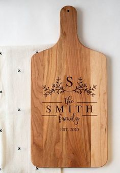 personalized cutting board with monogrammed name and date on the side for family