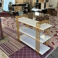 three glass tables sitting on top of a rug