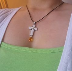 Pretty antique silver cross pendant with a orange jewel hung on a black waxed cord necklace. This is such a unique cross pendant and would look great layed with a choker or worn on its own. It has a 90s feel to it too!  I have similar unique cross necklaces on my page so to see more click here : https://www.etsy.com/shop/Sanctuswonders?ref=l2-about-shopname Thank you for visiting my shop! I hope you find what you are looking for! I specialise in and like to sell the following: Christian necklace 90s Cross Necklace, Cross Necklace Gothic, Spiritual Red Cross Pendant Necklace, Grunge Cross Necklace, Bible Jewelry, Spiritual Cross-shaped Gemstone Necklace, Catholic Necklace, Virgin Mary Necklace, Y2k Necklace