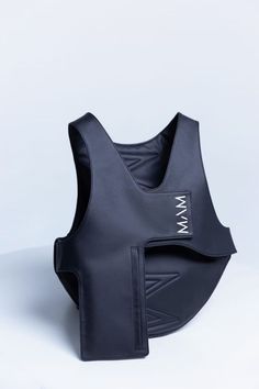 a black leather mask with the word wm on it