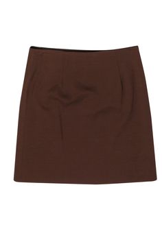 Wrap yourself in some fab fall style with this chic little skirt from Tara Jarmon! Created in a trendy mini silhouette with an easy wrap closure in a warm wool blend, this button-up beauty is perfect for wherever the season takes you! Whether you’re off to the pumpkin patch or gathering around the table for Thanksgiving dinner, pair this with a cozy turtleneck and your best booties and you’ll be styling and profiling all autumn long! Size S (EU 36) Shell: 52% Viscose, 40% Wool, 6% Nylon, 2% Span Solid Mini Skirt For Fall, Chic Formal Fall Skort, Chic Formal Skort For Fall, Elegant Solid Mini Skirt For Fall, Fitted Solid Mini Skirt For Fall, Formal Mini Skirt For Fall, Solid Color Lined Mini Skirt For Fall, Solid Color Mini Skirt For Office In Fall, Brown Skort For Workwear In Fall