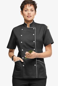 Women's modern fit short sleeve chef coat has back ties for an adjustable fit. Two front pockets carry your belongings while the double pocket on the left sleeve holds your thermometer or pens. Fabric covered buttons complete this look. Made of soft, easy care 65/35 poly/cotton. Approximate length for size Medium is 27 ½". • Modern fit • Stand collar • Double breasted • Fabric covered button closure • Total of 3 pockets • 2 front slant pockets • 1 left sleeve pocket • Short sleeves • Back ties • Chef Uniform Women, Semi Formal Mujer, Chef Coats, Chef Uniforms, Chef Wear, Chef Uniform, Compression Wear, Female Chef, Chef Coat