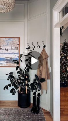 a living room filled with furniture and a christmas tree