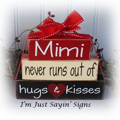 a sign that says mimi never runs out of hugs and kisses i'm just saying signs