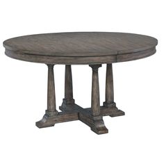 a round wooden table with four pillars on each side