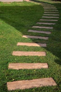 a set of stepping stones in the grass