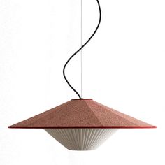 a red and white light hanging from a ceiling fixture with a long black cord attached to it