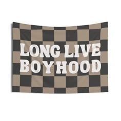 a black and white checkered wall tapestry with the words long live boyhood on it