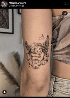 a woman's arm with an angel tattoo on the left side of her arm