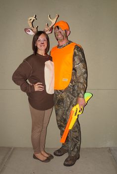 a man and woman dressed up in deer costumes