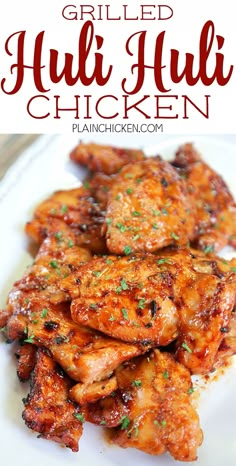 grilled chicken with sauce and parsley on top is shown in front of the plate