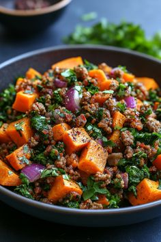 Sweet potato and sausage hash with red onions and fresh herbs in a black bowl. Sweet Potato And Bacon Recipes, African Sweet Potato Recipes, Mexican Sweet Potato Recipes, Potato Meal Ideas, Sweet Potato Crockpot Recipes, Sweet Potato Meals, Potato Recipe Ideas, Pork Sweet Potato, Potato Meals