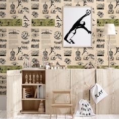 the wallpaper in this room is decorated with black and white images, including an image of a man on a skateboard