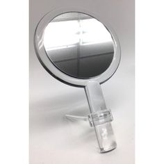 a small round mirror on a stand