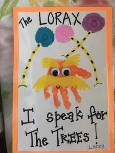 the lorax i speak for the trees sign is displayed on a tablecloth