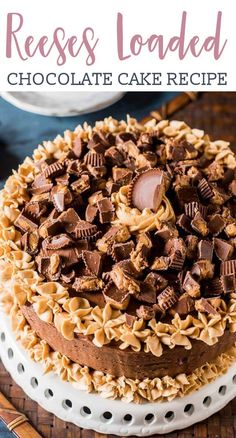 a cake with chocolate frosting and peanut butter on top, sitting on a plate