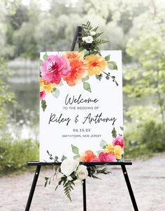 a welcome sign with flowers on it