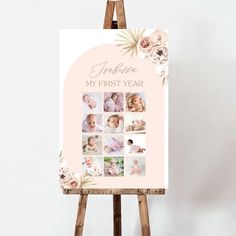 a baby's first year photo card on an easel with flowers and leaves