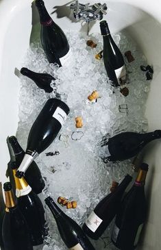 there are many bottles of wine in the ice