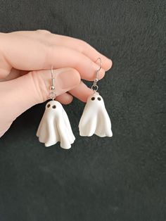 Spooky Ghost Earrings - Handmade Polymer Clay Halloween JewelryGet into the Halloween spirit with these adorable Ghost Earrings! Handmade with love from high-quality polymer clay, these charming ghost earrings are perfect for adding a touch of spooky fun to your outfit. Whether you're attending a Halloween party, trick-or-treating, or just want to celebrate the season, these earrings are sure to make a statement. Each pair is handcrafted with precision and attention to detail, making every piece unique. You will receive an exclusive item that embodies the warmth and care of the artisan.Made from durable and lightweight polymer clay, these earrings are hypoallergenic and comfortable to wear all day long. These ghost earrings are very lightweight and don't feel heavy on your earlobe. The hoo Clay Halloween, Spooky Earrings, Polymer Clay Halloween, Ghost Earrings, Earrings Halloween, Spooky Ghost, Halloween Spirit, Earrings Cute, Halloween Earrings