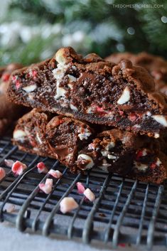 chocolate peppermint brownies on a cooling rack with candy canes and christmas tree in the background