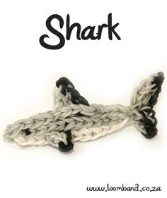 a white and black crochet hook with the word shark on it's side