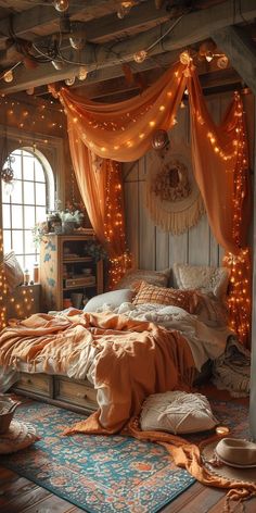 a bedroom decorated in orange and white with fairy lights