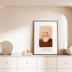 there is a white shelf with a vase on it next to a wall mounted poster