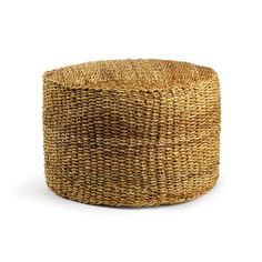 a small round woven basket on a white background