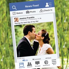 a couple kissing in front of a facebook page