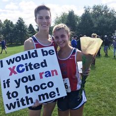 two girls holding up signs that say i would be x - cited if you ran to hoco with me