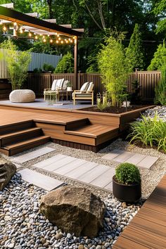 a wooden deck surrounded by rocks and plants