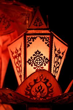 some red and white lanterns lit up in the dark