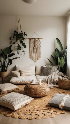 A living room bathed in soft sunlight, featuring earthy tones of brown, green, and cream. A large woven rug covers the floor, while oversized floor cushions invite relaxation. A macrame wall hanging adds a touch of bohemian flair, and potted plants bring the outdoors in. Meditation Floor Cushions, Earthy Spa Room, Cozy Yoga Studio, Bohemian Floor Seating, Floor Sitting Living Room, Floor Pillow Living Room, Zen Style Living Room, Bohemian Meditation Room, Boho Chic Living Room Ideas