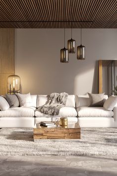 a living room filled with lots of white furniture and pillows on top of a rug