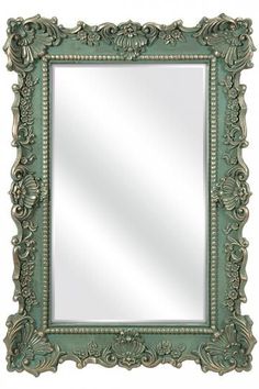 an ornate green frame mirror on a white background