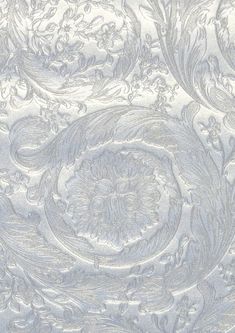 an intricately designed wallpaper in silver and white