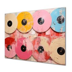 an abstract painting with different colored discs on it