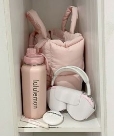 the contents of a baby's diaper and bottle are neatly organized in a closet