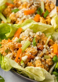 lettuce with carrots and cheese in a bowl