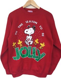 a red sweatshirt that says it's the reason to be jolly