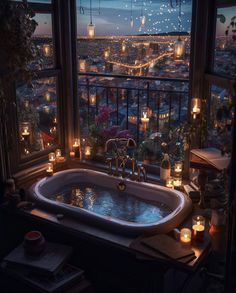 a bathtub with candles on the window sill in front of a city view