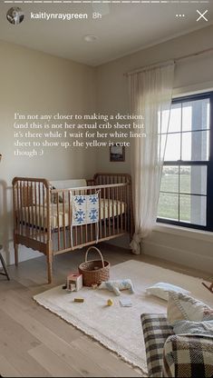 a baby crib in the corner of a room next to a chair and window