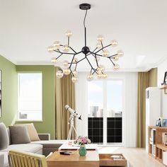 a living room filled with furniture and a chandelier hanging over the top of it