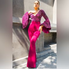 This Stunning Jumpsuit Features A Beautiful Sequin Top With Flared Sleeves And A Flattering V-Neckline. The Bottom Of The Jumpsuit Has A Comfortable And Stylish Fit With A Zip Closure, Perfect For Any Occasion. The Jumpsuit Is Made Of A High-Quality Polyester And Spandex Blend, Ensuring A Comfortable Fit That Is Also Machine Washable. Glamorous Pink V-neck Jumpsuits And Rompers, Elegant High Waist Pink Jumpsuits And Rompers, Elegant Pink High-waist Jumpsuits And Rompers, Red Fitted V-neck Jumpsuit, High-waist Pink Jumpsuit For Party, High Waist Pink Jumpsuit For Party, Pink High-waist Jumpsuits And Rompers For Party, Pink High-waist Jumpsuit For Party, Glamorous V-neck Jumpsuits And Rompers For Party