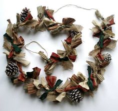 a close up of a wreath made out of fabric and pine cones