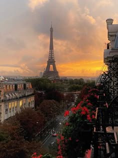 the eiffel tower towering over paris at sunset